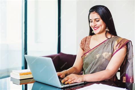 Premium Photo Beutiful Indian Woman In A Saree Working On Her Laptop