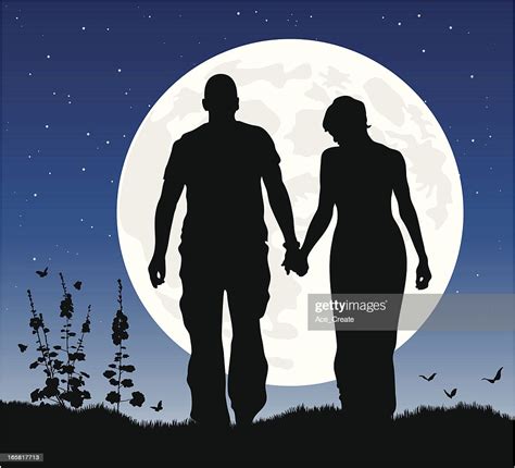 Romantic Couple At Night In Silhouette Against The Moon