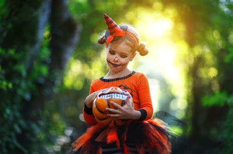 Happy Halloween Horrible Creepy Child Girl In Pumpkin Costume Stock