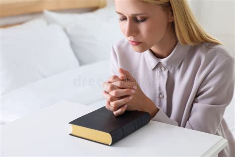 Religious Young Woman With Bible Praying In Bedroom Stock Image Image