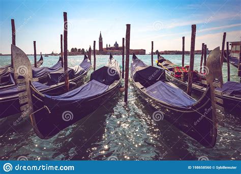 Venetian Gondolas And San Giorgio Maggiore Island In Venice Italy