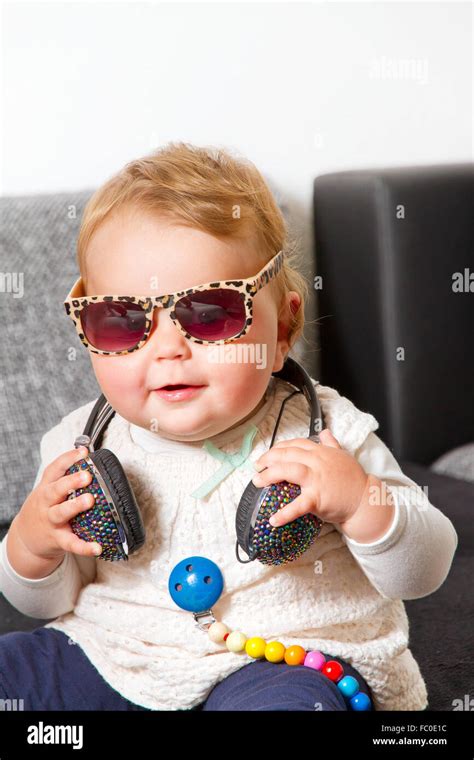 Little Baby With Headphones And Sunglasses Stock Photo Alamy