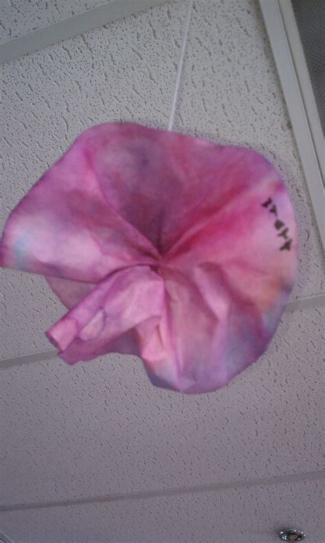 Tie dye flowers coffee filter. To make a tie-dye flower, have children color on a coffee ...
