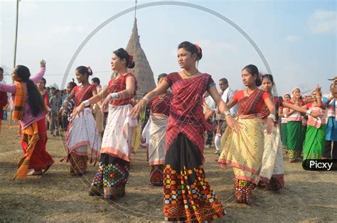 Image Of Assam Tribal Woman Performing Bihu Dance During Magh Bihu