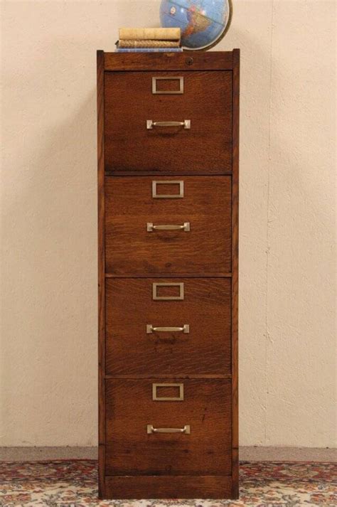The case houses four stacked drawers with brass pulls and identification windows to the front. Globe 4 Drawer Oak 1915 Antique Craftsman File Cabinet ...