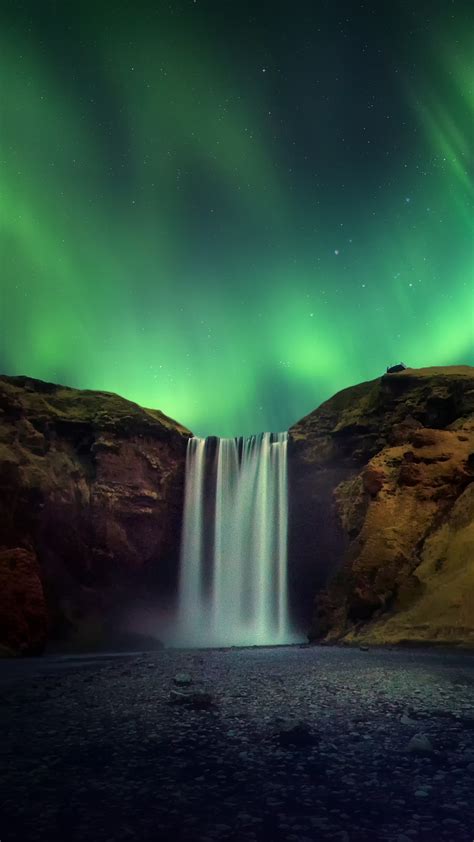 Skógafoss Waterfall With Aurora Borealis Or Northern Light Iceland