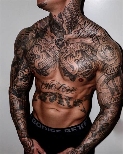 A Man With Lots Of Tattoos On His Chest