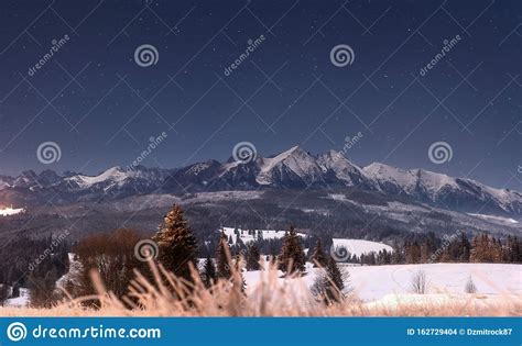 Winter Mountains At Night Starry Night Over Snowy Summits Of Mountain
