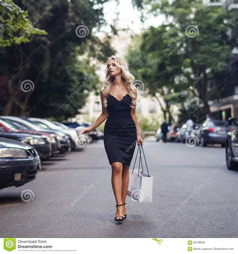 Elegant Blonde Woman Walking On The Street Stock Photo Image Of