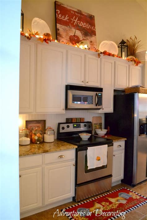 One of the best small kitchen decorating ideas is to coordinate matching colored smaller pieces throughout using glass for your cabinet doors is a unique way to display everything. Adventures in Decorating: Our Fall Kitchen ...
