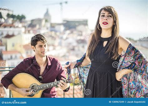 Beautiful Fado Singer Performing With Handsome Portuguese Guitar Stock