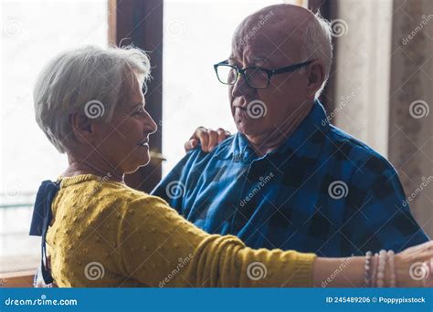 Joyful Active Old Retired Caucasian Couple Dancing In Their Living Room Closeup Indoor Shot