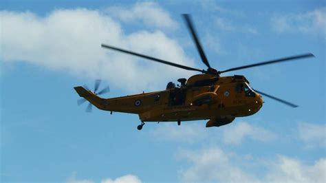 Rescue Yellow Helicopter High In The Blue Sky Free Image Download