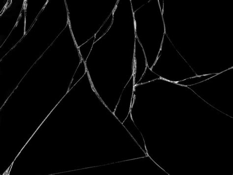 Premium Photo Cracked Glass Texture On Black Background
