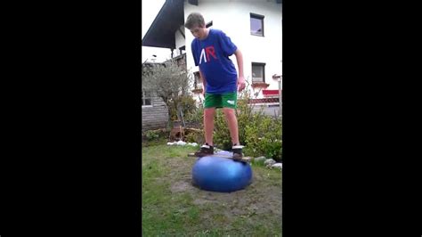 Guy Tries To Balance On Red Yoga Ball Jukin Media Inc