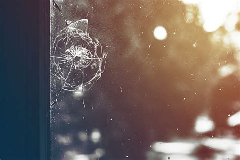 Bullet Hole In The Window Toned Stock Photo Download Image Now Istock