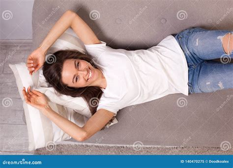 Beautiful Happy Young Woman Lying On A Sofa Stock Image Image Of Furniture Girl 140470275