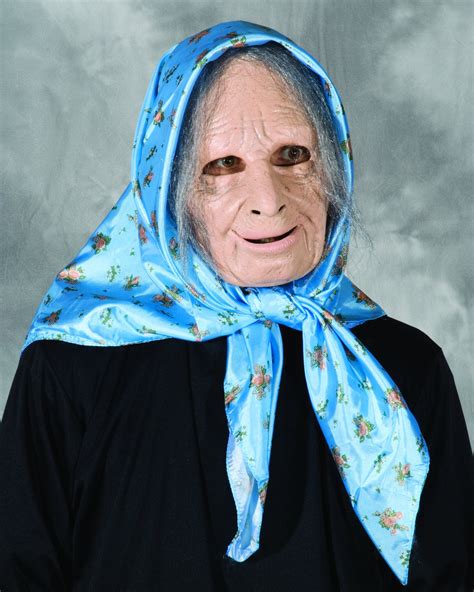 An Old Woman Wearing A Blue Scarf With Flowers On It And Her Face Is