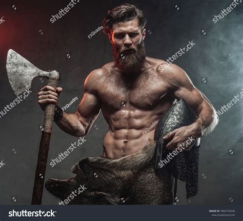 Стоковая фотография 1860753628 Serious Muscular Viking Beard Naked