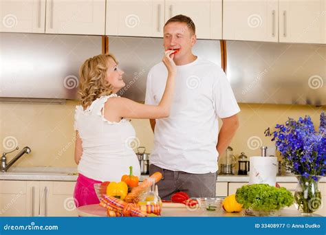 woman feeds her husband with vegetables stock image image of cheerful