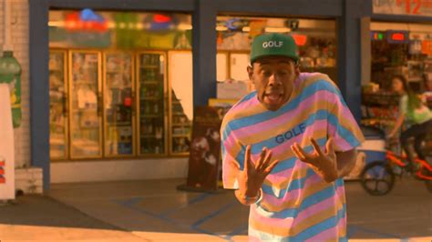 Tyler The Creator Is Standing In A Store Background With Eyes Closed Hd