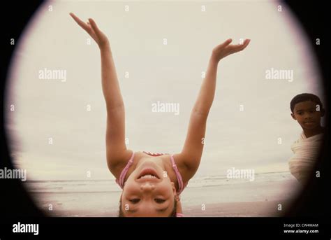 Close Up Of A Girl Bending Over Backwards On The Beach Stock Photo Alamy