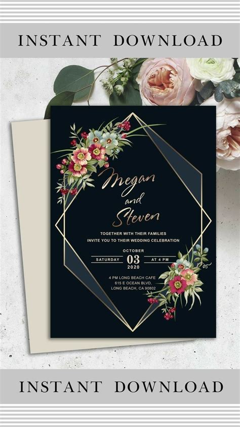 An Elegant Wedding Card With Flowers And Greenery Is Displayed On Top