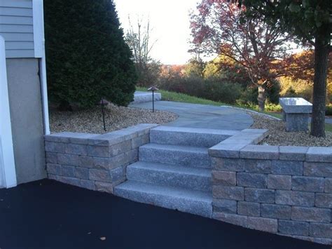 We built a retaining wall with steps built at the side , a new block paving driveway and decorative stones put down. Pin by Jody Karpinski on back yard | Landscaping retaining ...