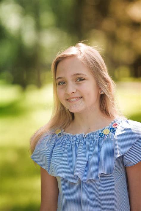 Portrait Of A Beautiful Young Girl In The Park Stock Photo Image Of