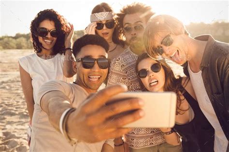 Multiracial Group Of Friends Taking Selfie By Vadymvdrobot Multiracial