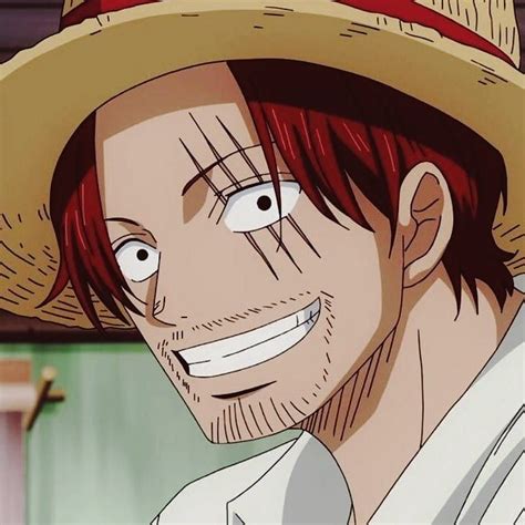 A Man With Red Hair Wearing A Straw Hat And Looking At The Camera While Smiling