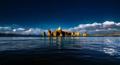 Brown Rock Formation Near Water Hd Wallpaper Wallpaper Flare