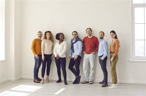 Group Of Diverse People In Casual Wear Standing Together In Empty