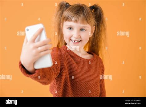 Little Girl Taking Selfie On Color Background Stock Photo Alamy
