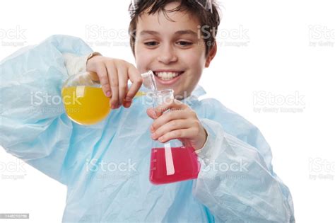 Selective Focus On Laboratory Glass Flasks In The Hands Of A Cute