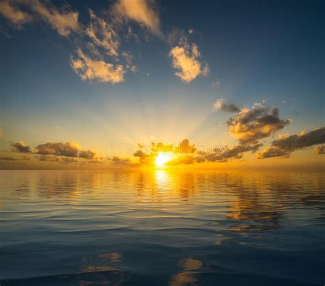 Beautiful Sunset Reflected In A Calm Peaceful Ocean As Concept For
