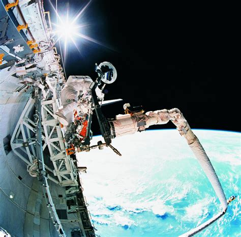 An Astronaut Working In Space Photograph By Stockbyte