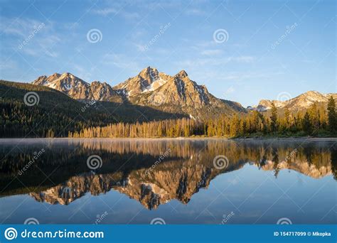 Sunrise At Stanley Lake With Sawtooth Mountains Reflecting In The Calm