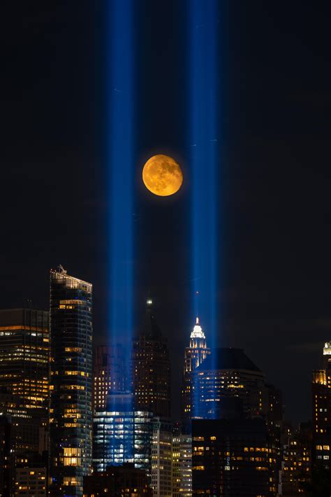 Moon rising between 9/11 tribute lights yesterday night : newjersey