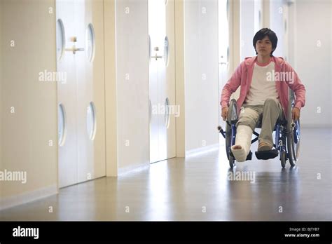 Man With Broken Leg In A Wheelchair Stock Photo Alamy