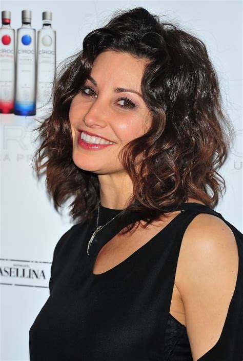 Wondering how to style your hair as you reach your 60s? Gina Gershon Cute Medium Hairstyle with Loose Waves ...