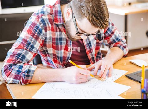 Man Sitting At Desk Drawing Hi Res Stock Photography And Images Alamy