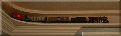 Since we do not have a room to dedicate for a permenant layout, we decided to do an extreme bedroom makeover. Michale: O gauge train display shelf