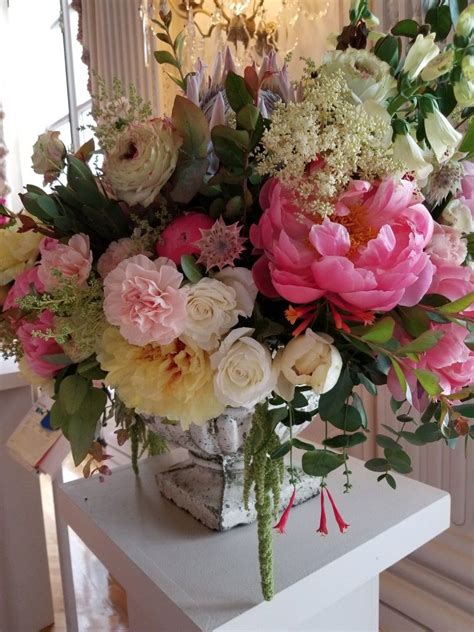 I thought a substantial floral arrangement in the center with a few photos placed around. Pin by Sharon Stephens on tropical theme/50th anniversary ...