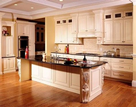 The rooms get lots of sun and face south. Cream colored kitchen cabinets with black granite top ...