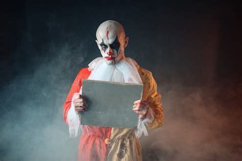 Premium Photo Portrait Of Scary Bloody Clown With Crazy Eyes
