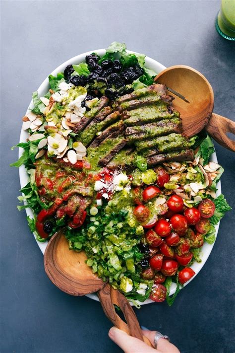 To assemble the salad, place the mixed greens on a large platter. Pin on dinner salads