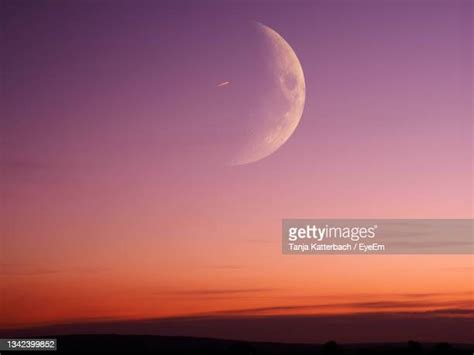 Sunset Moon Photos And Premium High Res Pictures Getty Images