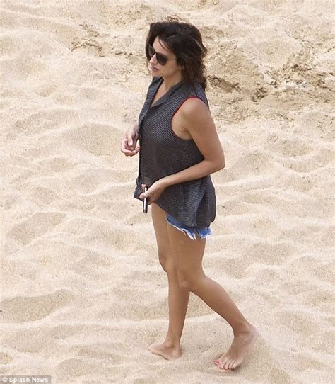 penelope cruz shows off stunning figure in red swimsuit on spanish beach daily mail online