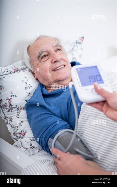 Patient Gets Blood Pressure Measured Stock Photo Alamy
